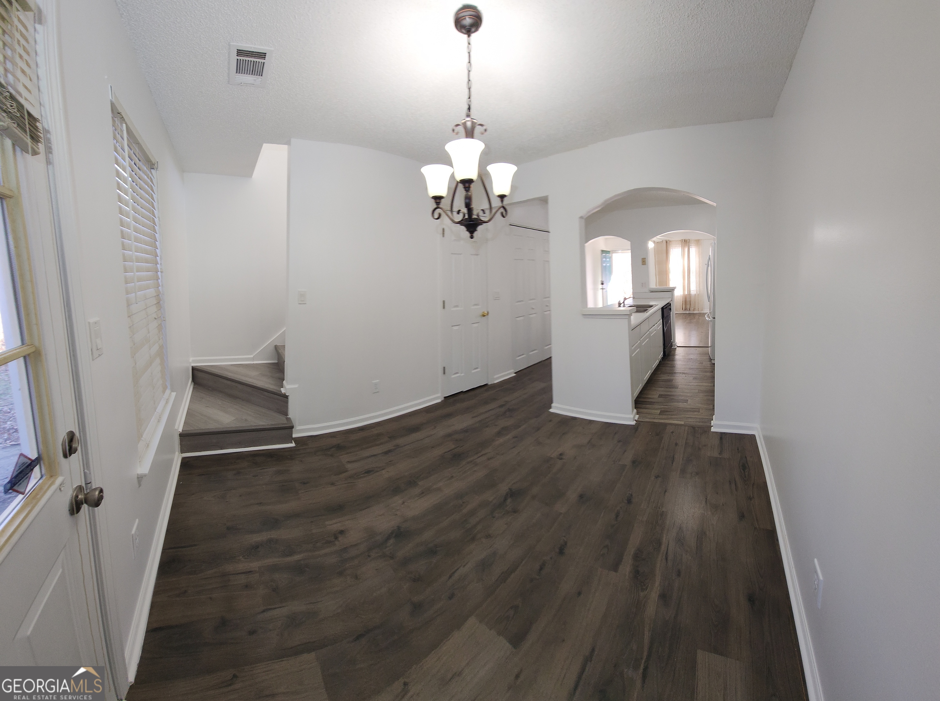 200 Glynn Addy Drive Stockbridge, GA 30281 - Photo 11 of 28 a view of a hallway with wooden floor and staircase