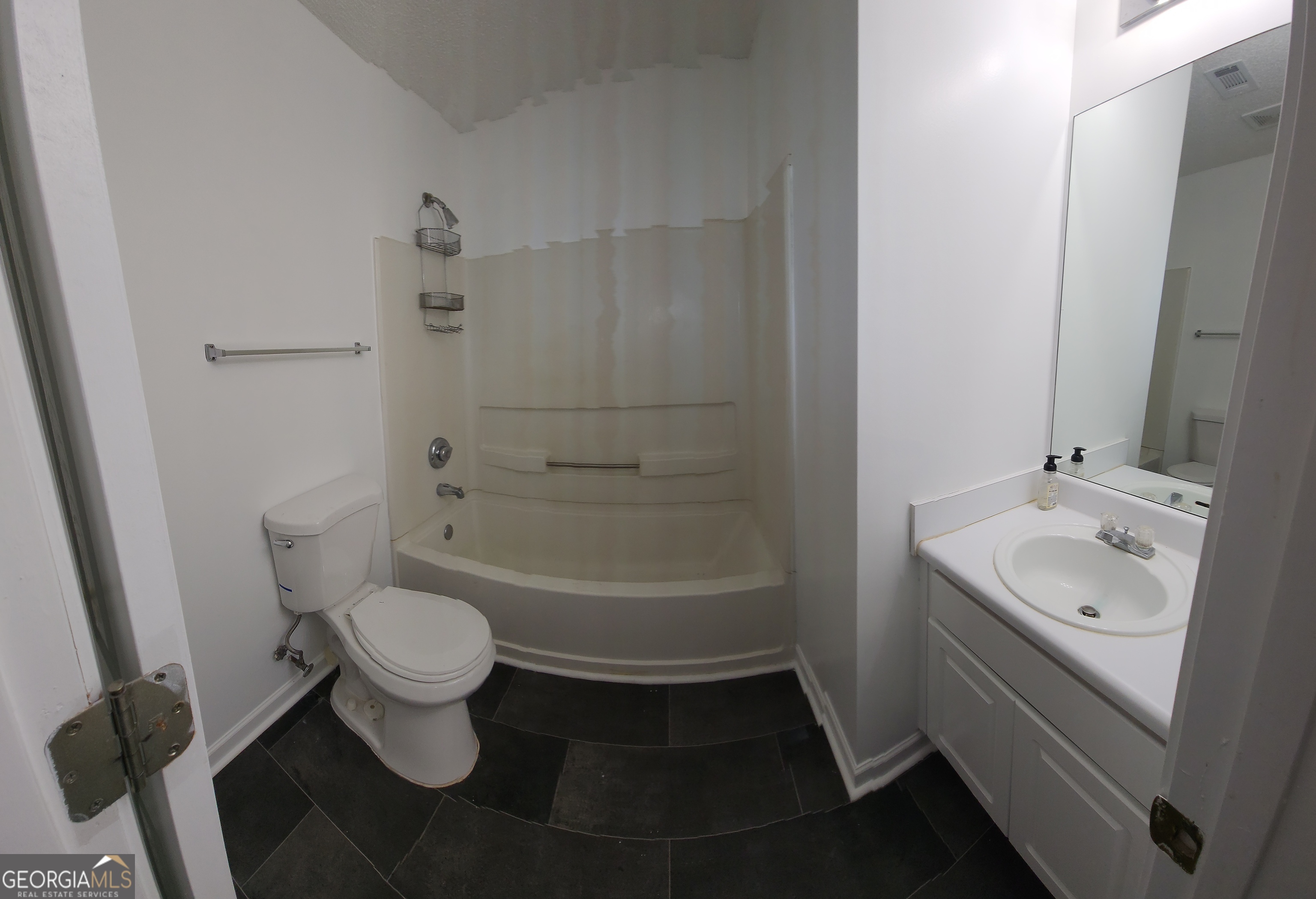 200 Glynn Addy Drive Stockbridge, GA 30281 - Photo 15 of 28 a bathroom with a sink toilet a mirror and shower