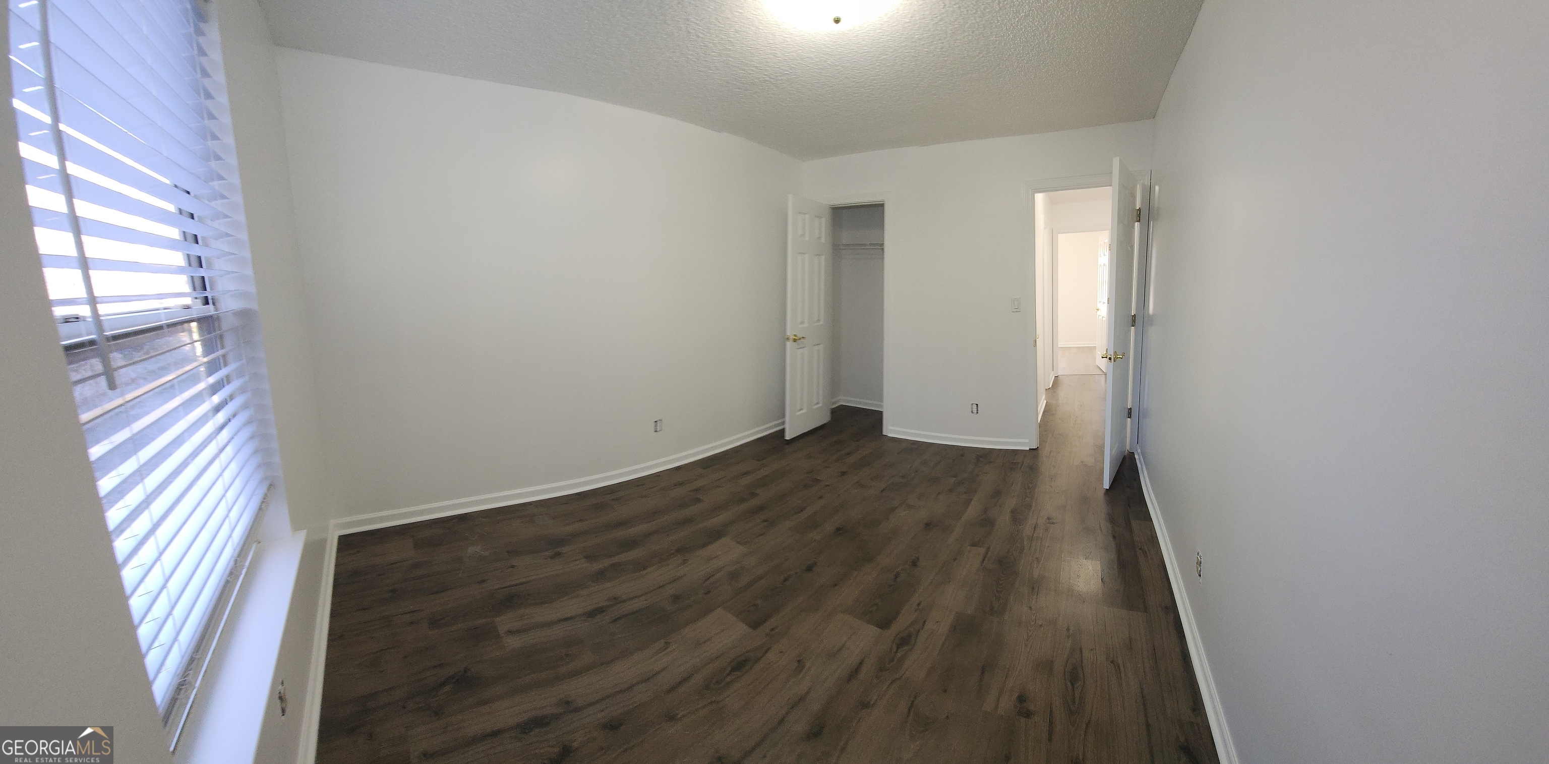200 Glynn Addy Drive Stockbridge, GA 30281 - Photo 18 of 28 wooden floor in an empty room with a window