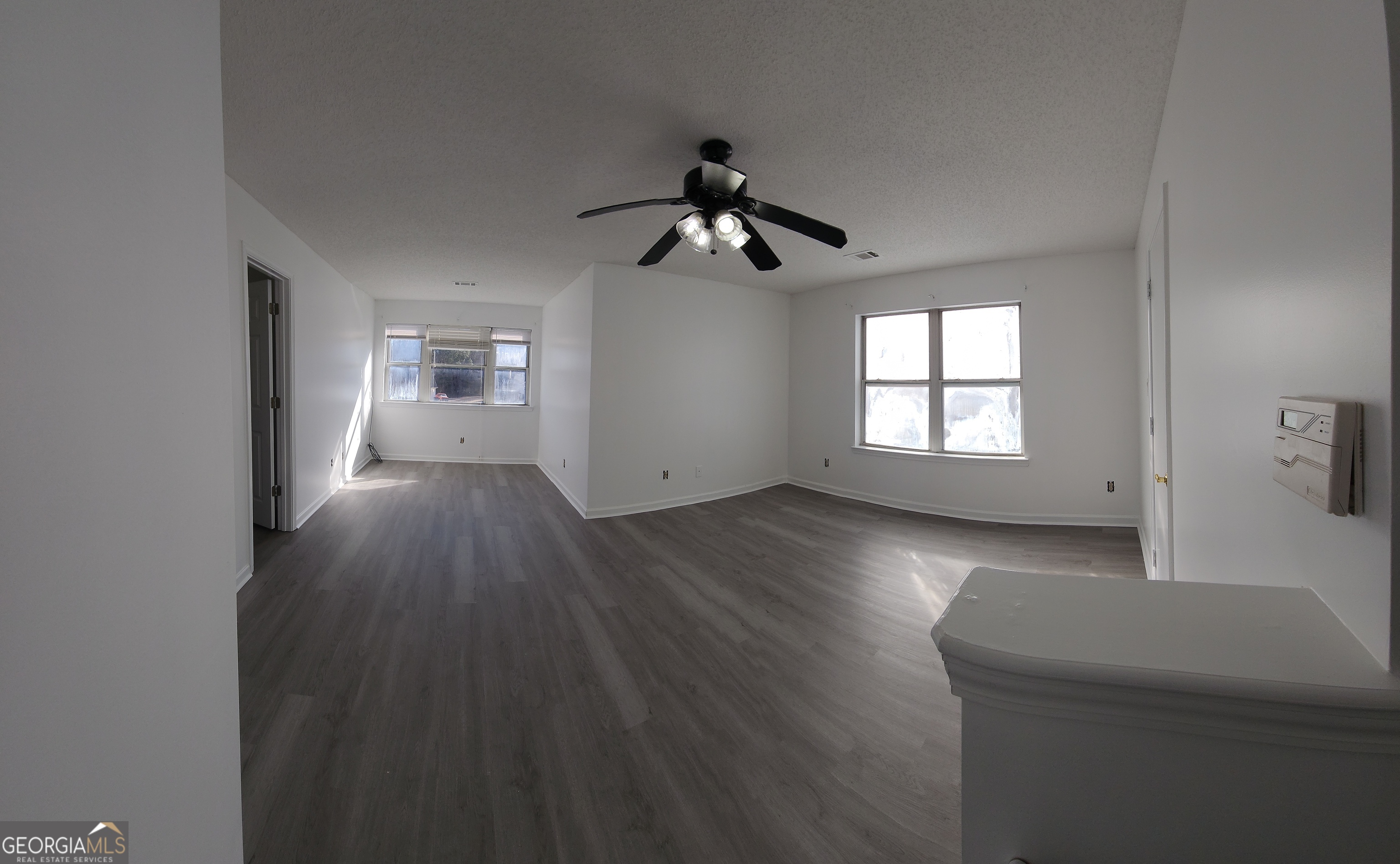 200 Glynn Addy Drive Stockbridge, GA 30281 - Photo 21 of 28 wooden floor in an empty room with a window
