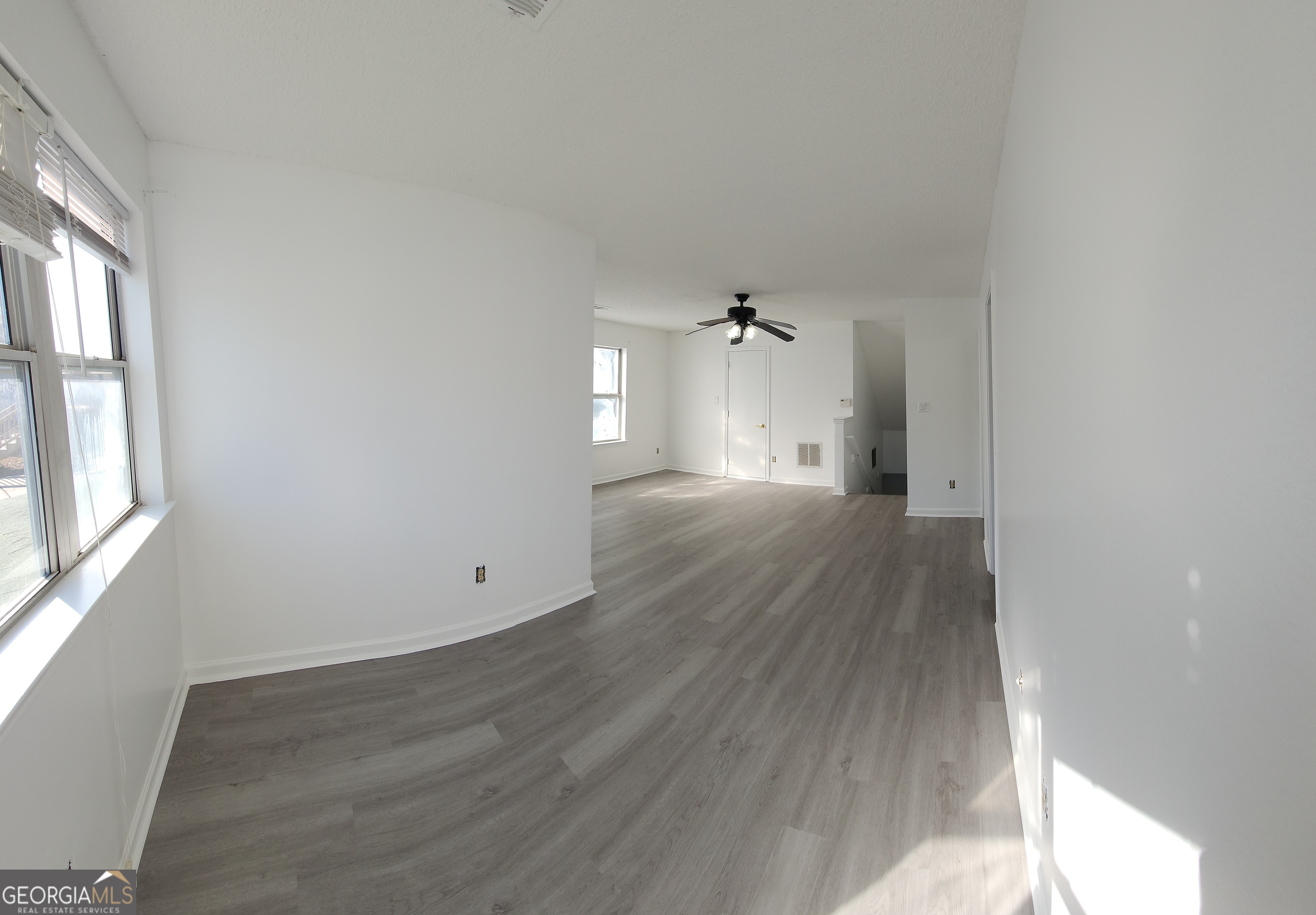 200 Glynn Addy Drive Stockbridge, GA 30281 - Photo 22 of 28 wooden floor in an empty room with a window