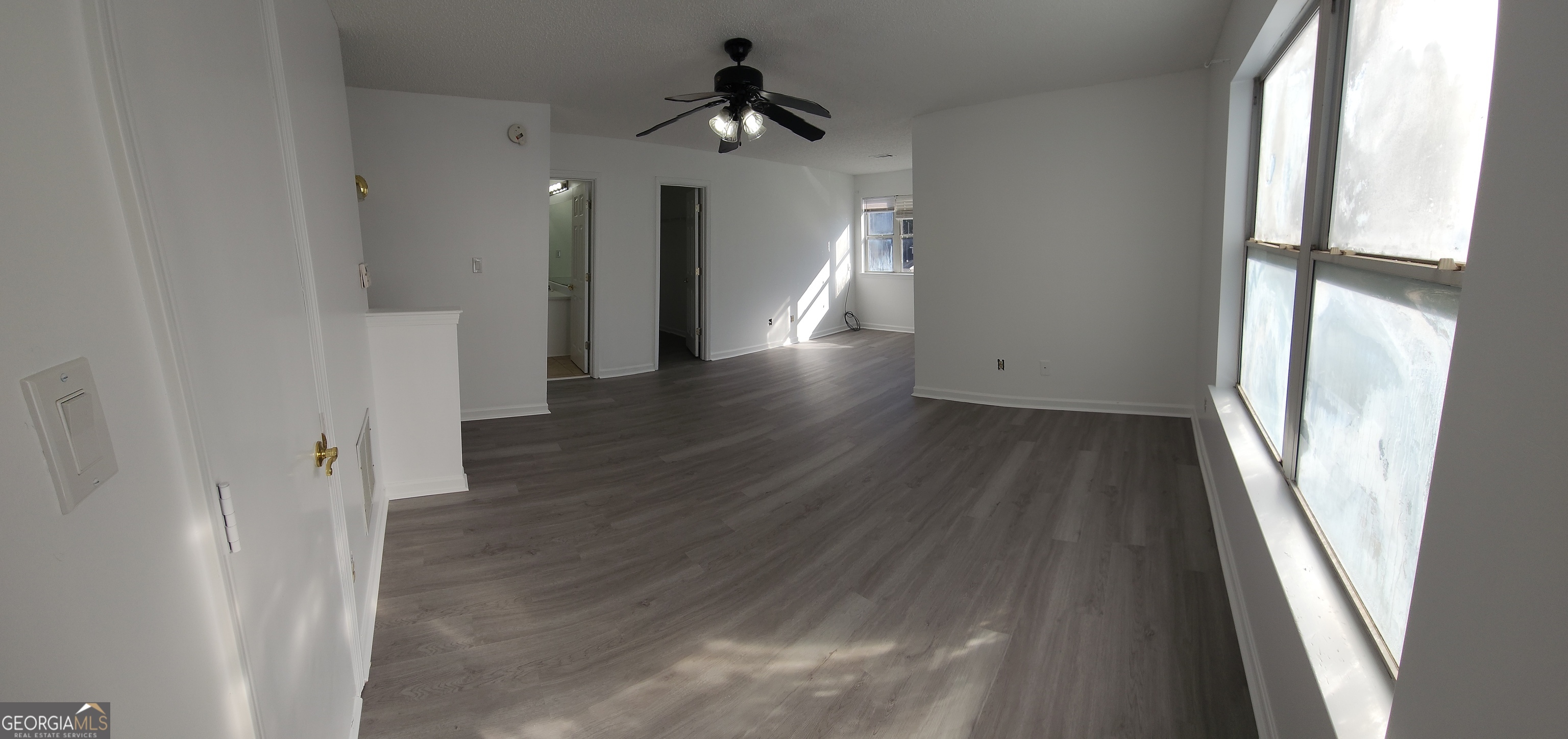200 Glynn Addy Drive Stockbridge, GA 30281 - Photo 23 of 28 a view of a hallway view with wooden floor and staircase