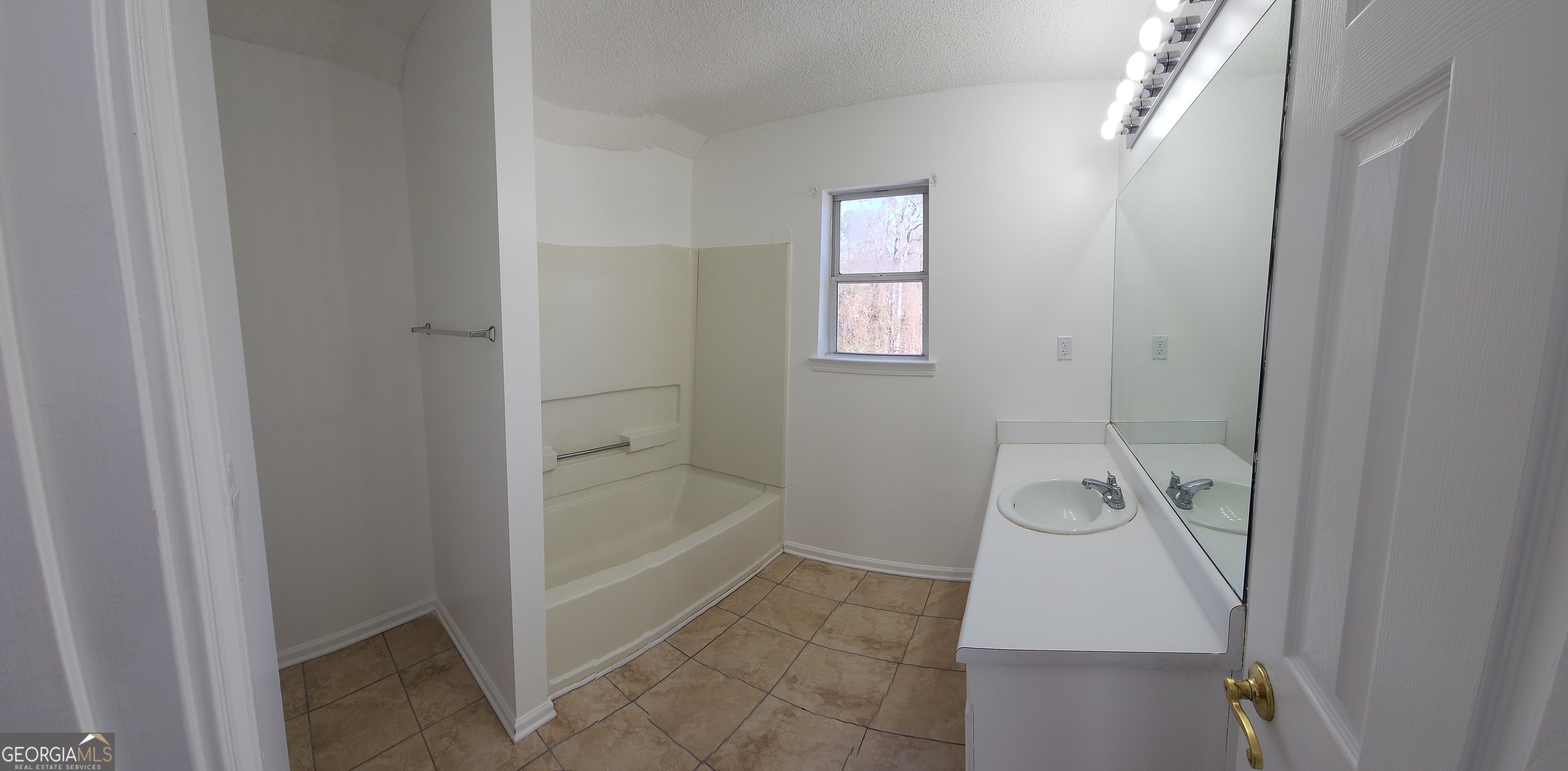 200 Glynn Addy Drive Stockbridge, GA 30281 - Photo 24 of 28 a bathroom with a tub and a shower