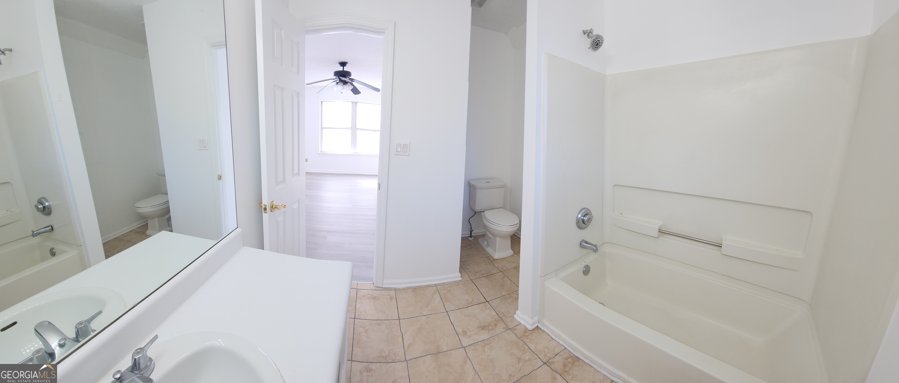 200 Glynn Addy Drive Stockbridge, GA 30281 - Photo 25 of 28 a bathroom with a tub and shower