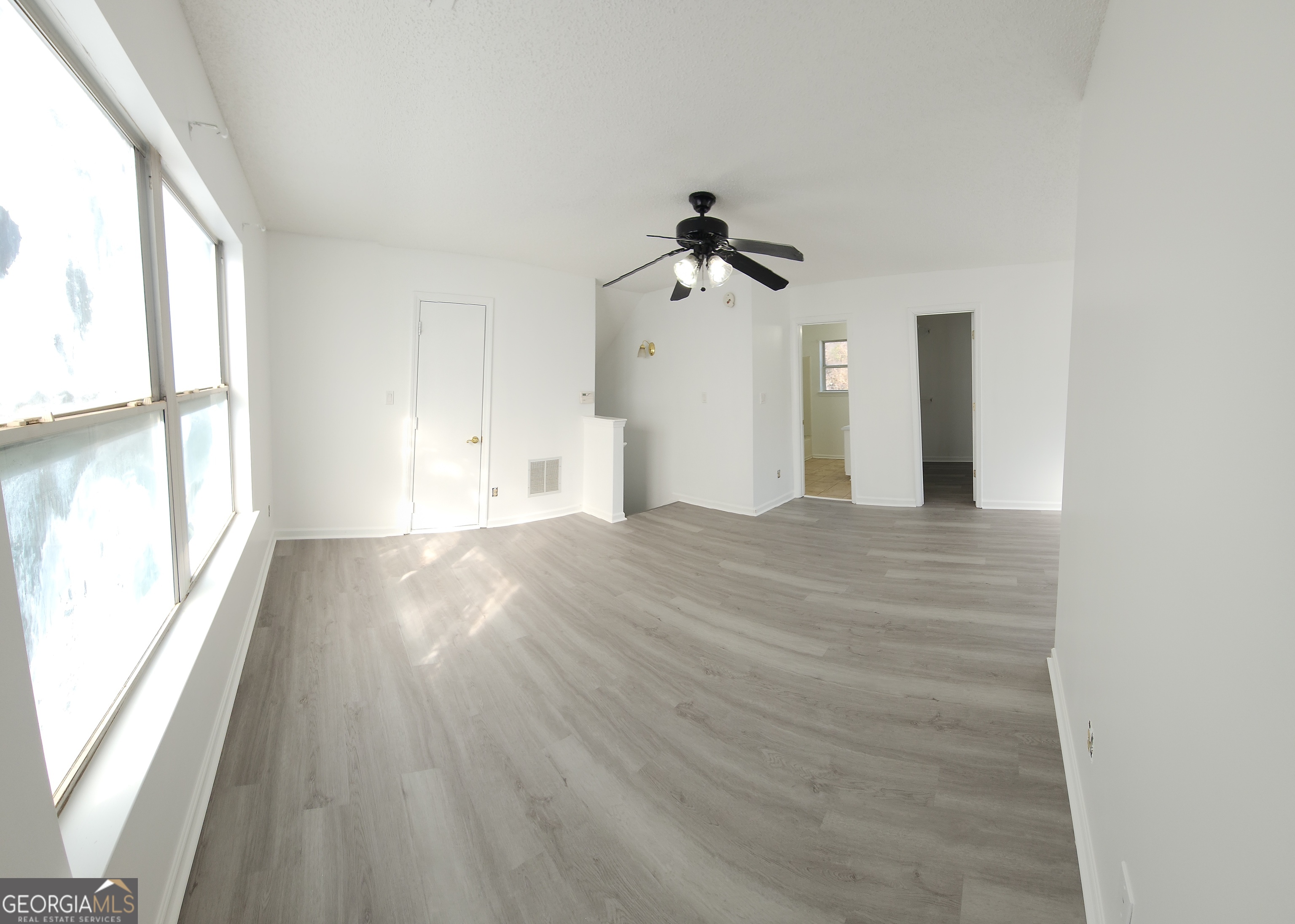 200 Glynn Addy Drive Stockbridge, GA 30281 - Photo 26 of 28 a view of empty room with wooden floor and fan