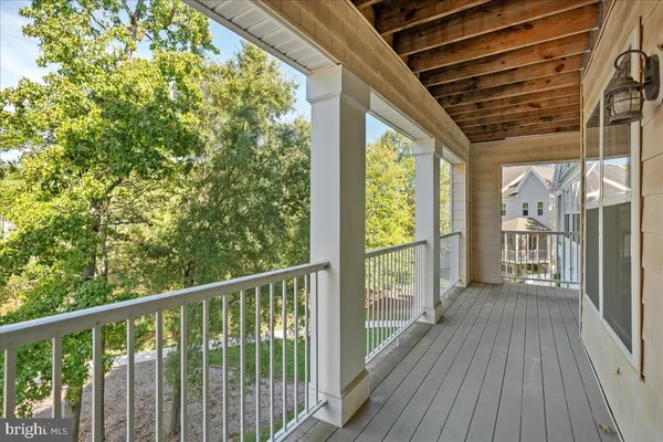 a view of a balcony with wooden floor