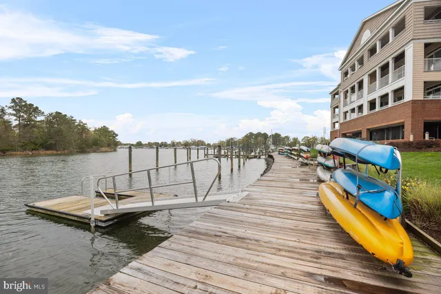 a view of a roof deck with lounge chairs