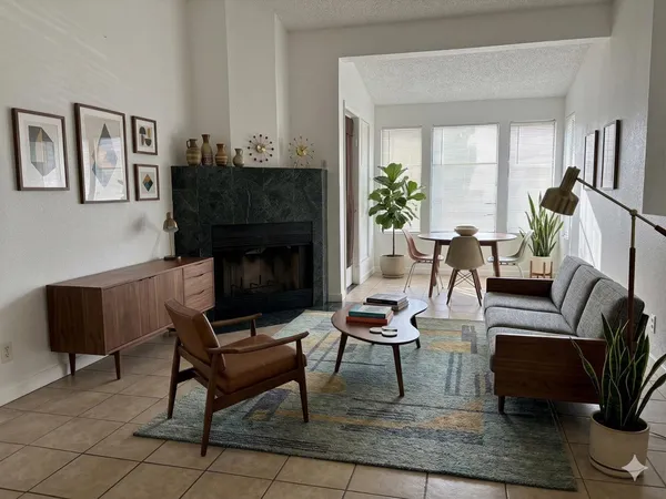 a living room with furniture and a fireplace