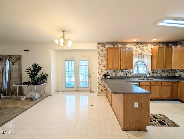 a kitchen with a sink and cabinets