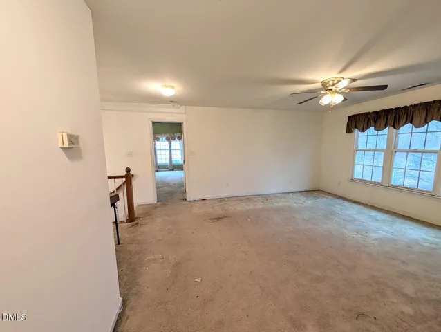 a view of a livingroom with a ceiling fan