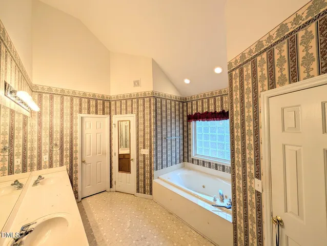 a view of a livingroom with furniture and a window