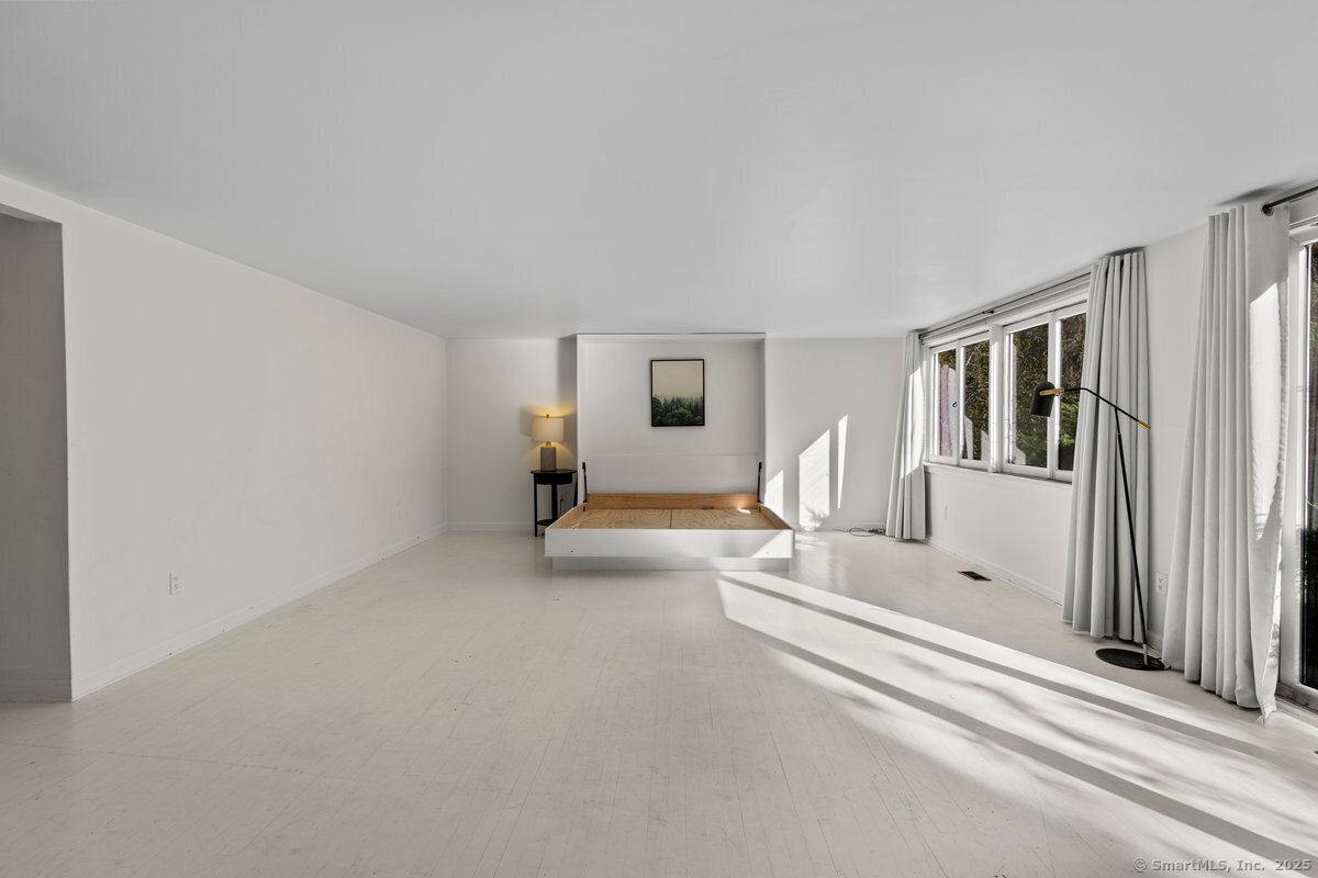 1166 Old Racebrook Road Woodbridge, CT 06525 - Photo 15 of 29 a view of a livingroom with furniture and stairs
