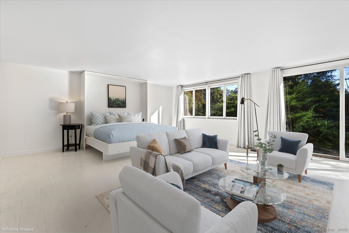 1166 Old Racebrook Road Woodbridge, CT 06525 - Photo 28 of 29 a living room with furniture and a large window