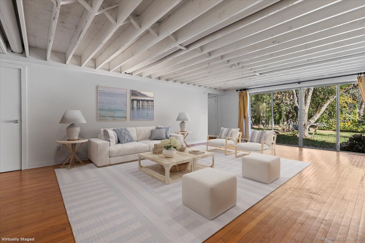 1166 Old Racebrook Road Woodbridge, CT 06525 - Photo 29 of 29 a living room with furniture and a large window