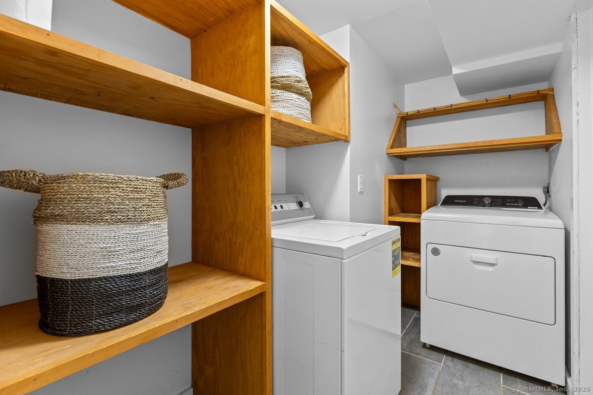 1166 Old Racebrook Road Woodbridge, CT 06525 - Photo 9 of 29 a view of storage and utility room with washer and dryer