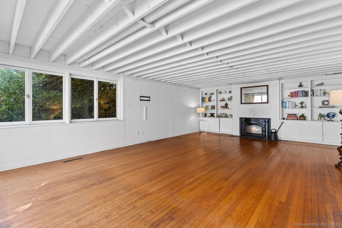 1166 Old Racebrook Road Woodbridge, CT 06525 - Photo 10 of 29 a view of a livingroom with furniture and wooden floor