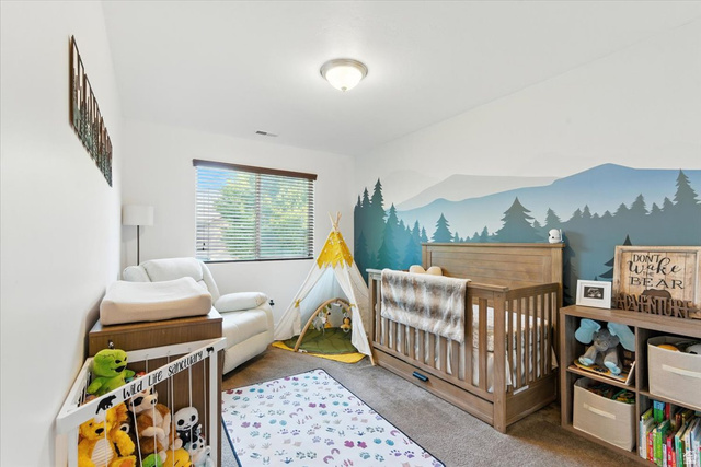 1187 Seraphim Court Layton, UT 84041 - Photo 12 of 18 Bedroom with a crib and carpet floors