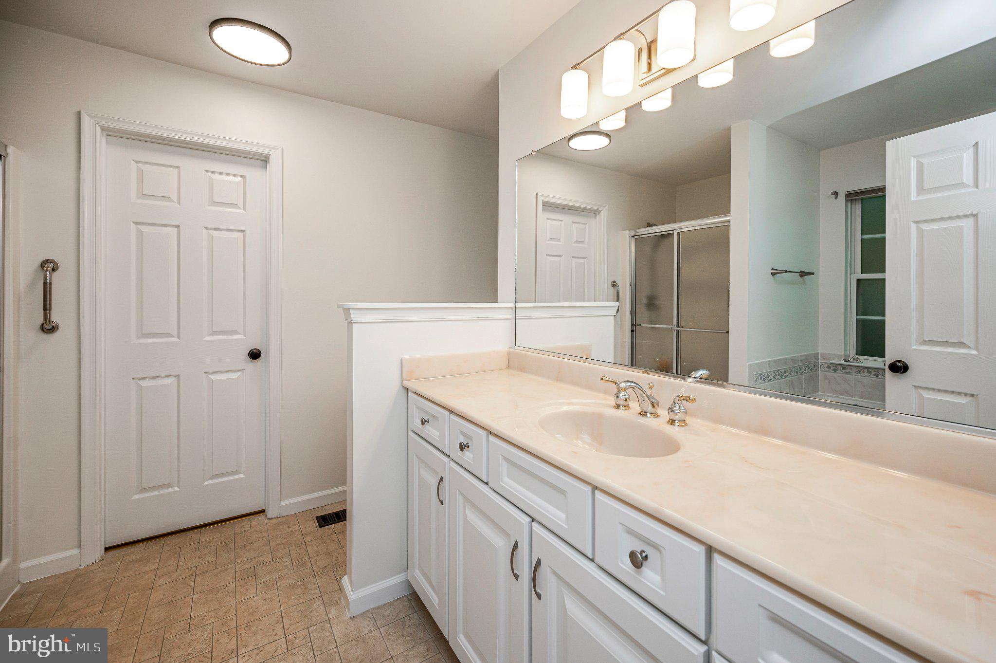 211 Battlefield Road Locust Grove, VA 22508 - Photo 31 of 57 Generous counter space and storage at the vanity