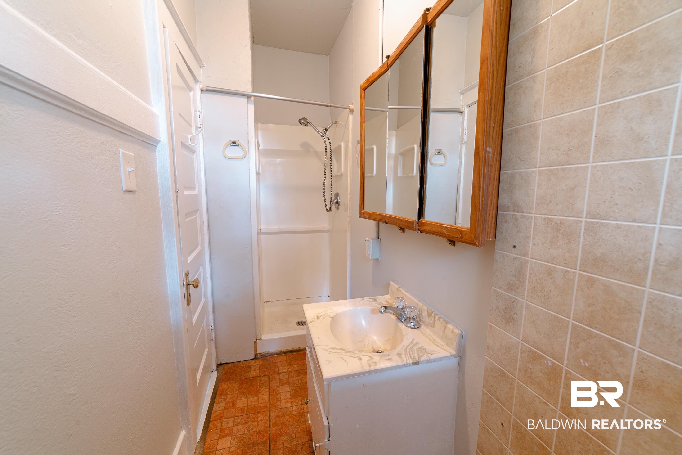 312 1st Street Mobile, AL 36611 - Photo 21 of 29 Bathroom with vanity and a shower