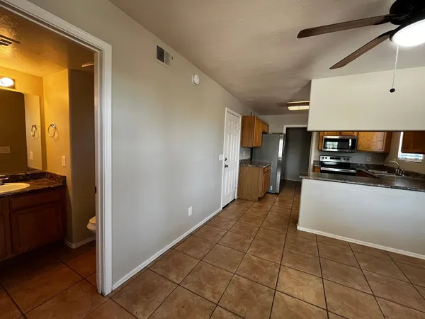 a view of a kitchen from the hallway