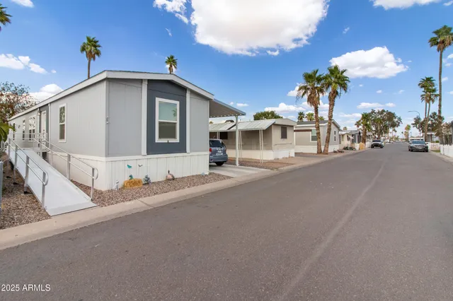 a view of a house with a yard and garage