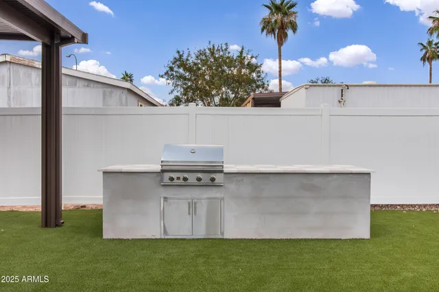 a view of a swimming pool with a table and chairs