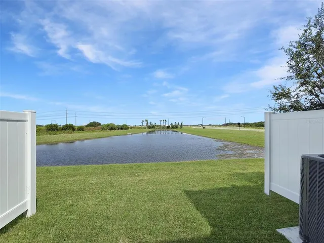 a view of lake with green space