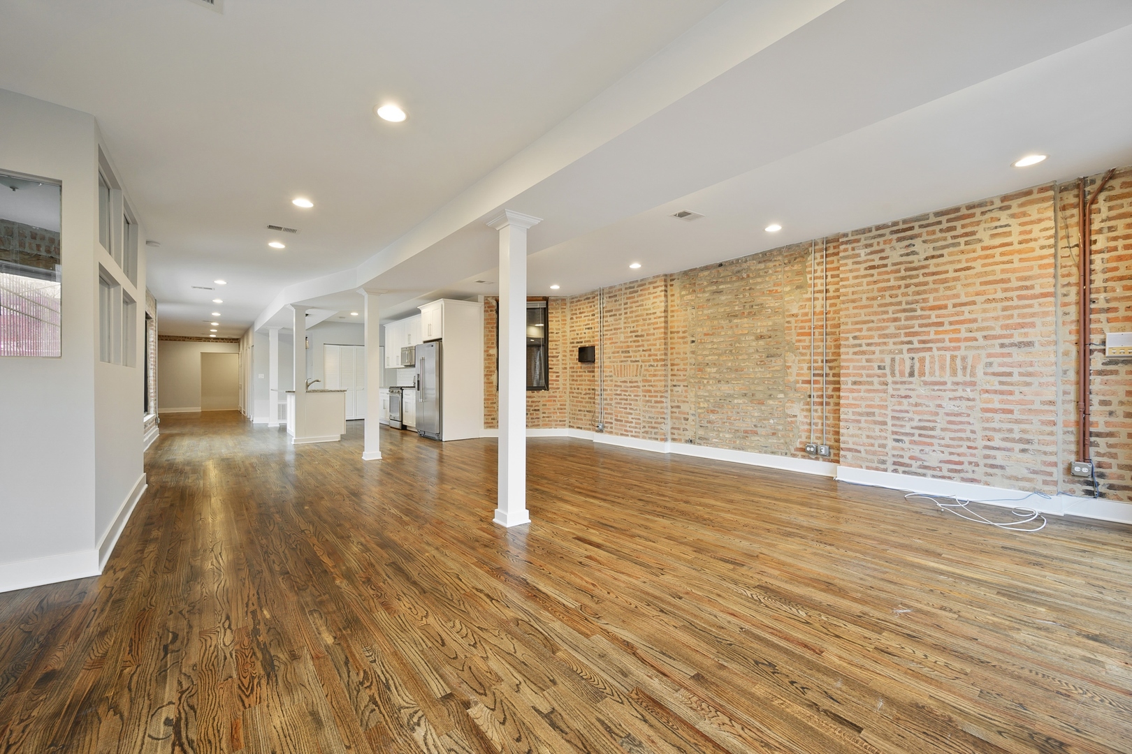 1015 West Lake Street, Unit 2E Chicago, IL 60607 - Photo 4 of 19 a view of a hallway with wooden floor