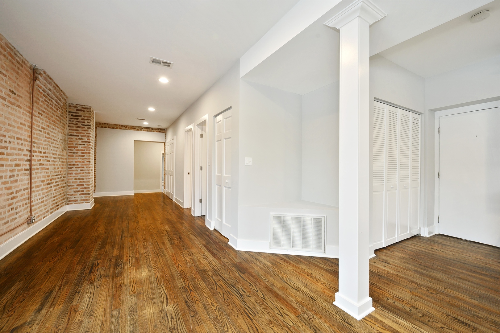1015 West Lake Street, Unit 2E Chicago, IL 60607 - Photo 10 of 19 a view of a bedroom with wooden floor and bedroom