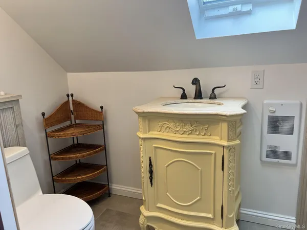 a bathroom with a toilet and a sink