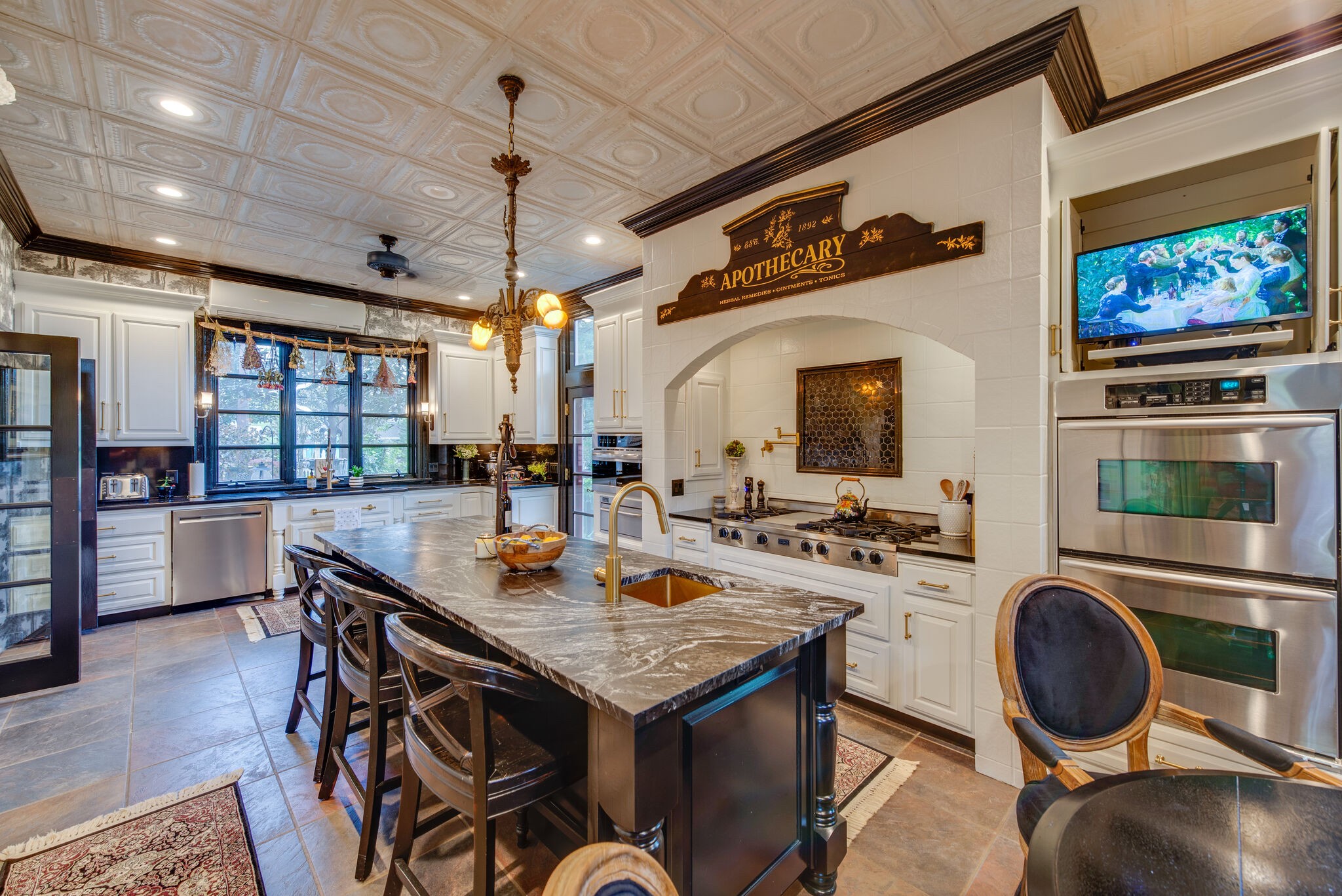 607 5th Avenue West Springfield, TN 37172 - Photo 29 of 50 a kitchen with a stove a refrigerator and a dining table