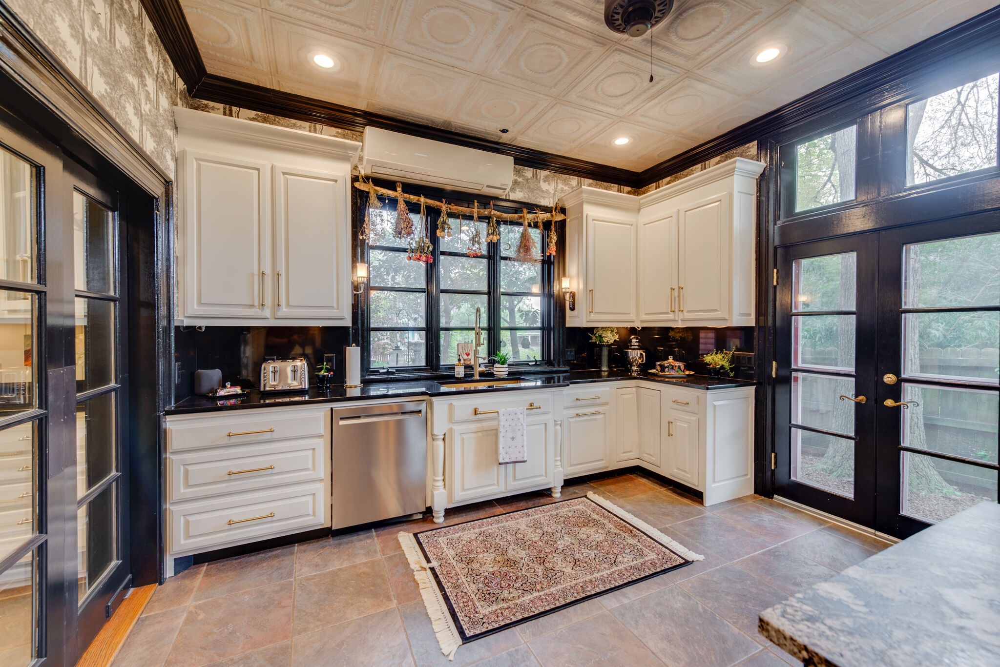 607 5th Avenue West Springfield, TN 37172 - Photo 30 of 50 a kitchen with granite countertop white cabinets and white appliances