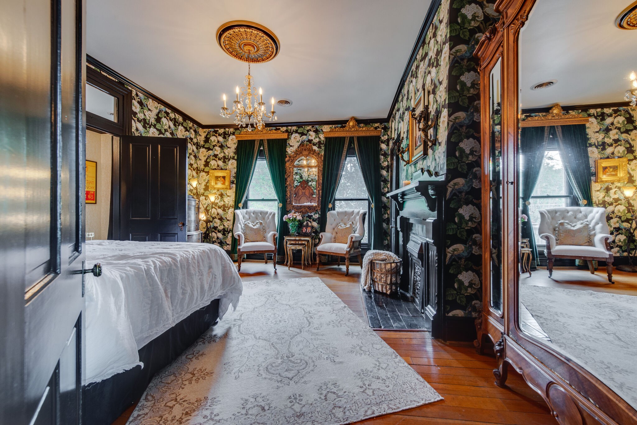 607 5th Avenue West Springfield, TN 37172 - Photo 38 of 50 a bed room with a bed and a chandelier