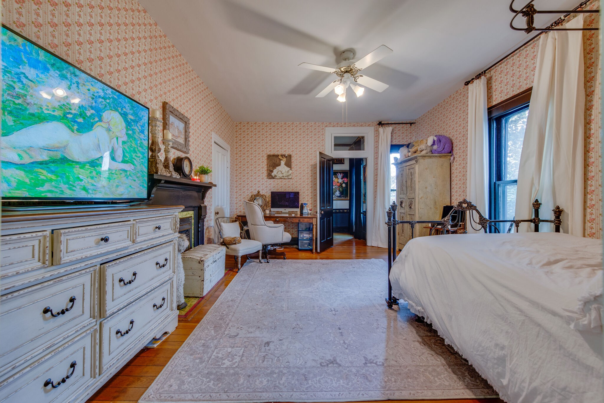 607 5th Avenue West Springfield, TN 37172 - Photo 43 of 50 a bed room with a bed and a flat tv screen on dresser