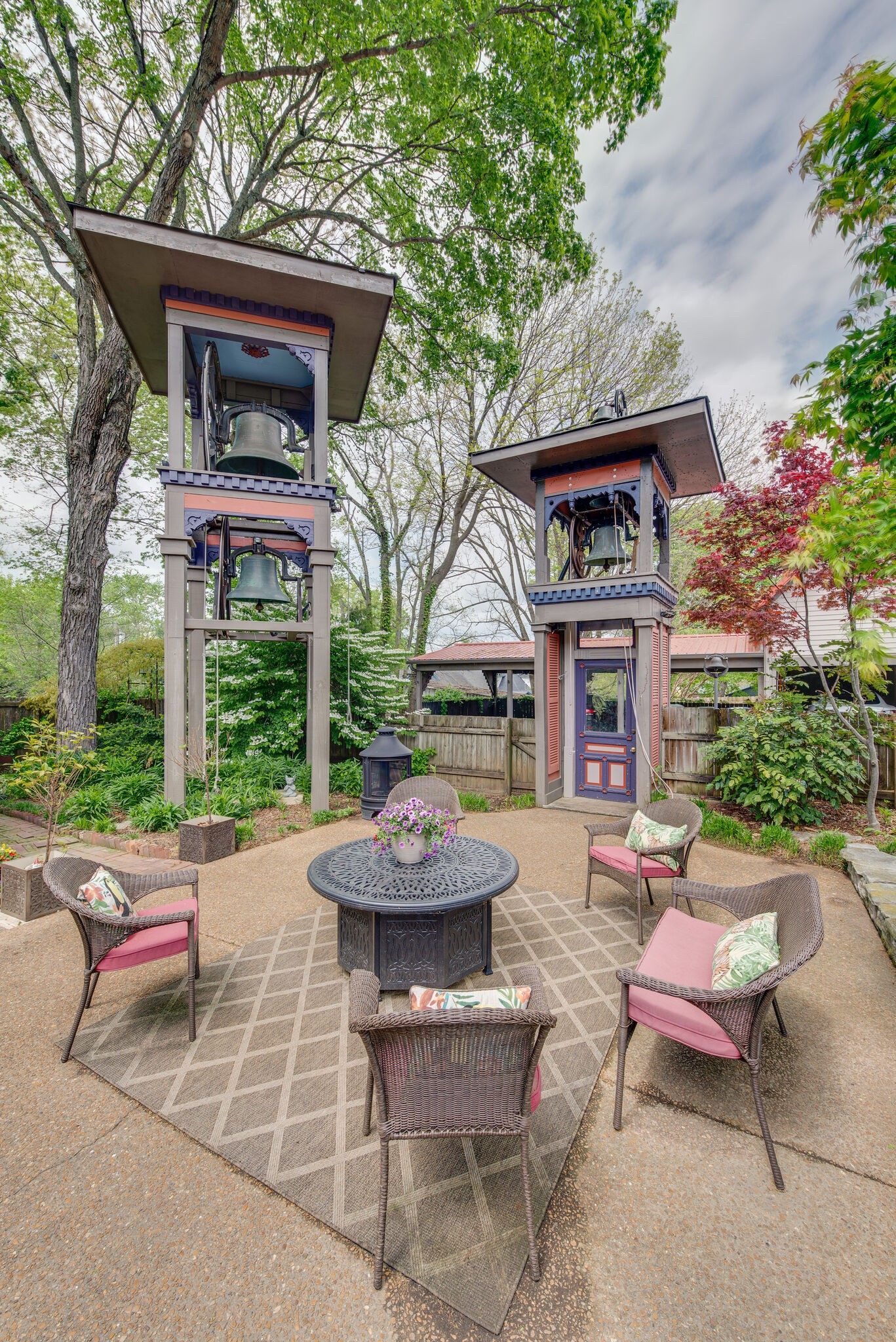 607 5th Avenue West Springfield, TN 37172 - Photo 47 of 50 a view of a patio with couches table and chairs potted plants and a large tree