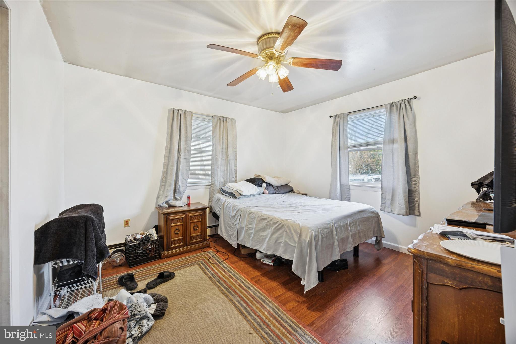 820 Keystone Street Croydon, PA 19021 - Photo 11 of 15 a bedroom with a bed and a chandelier