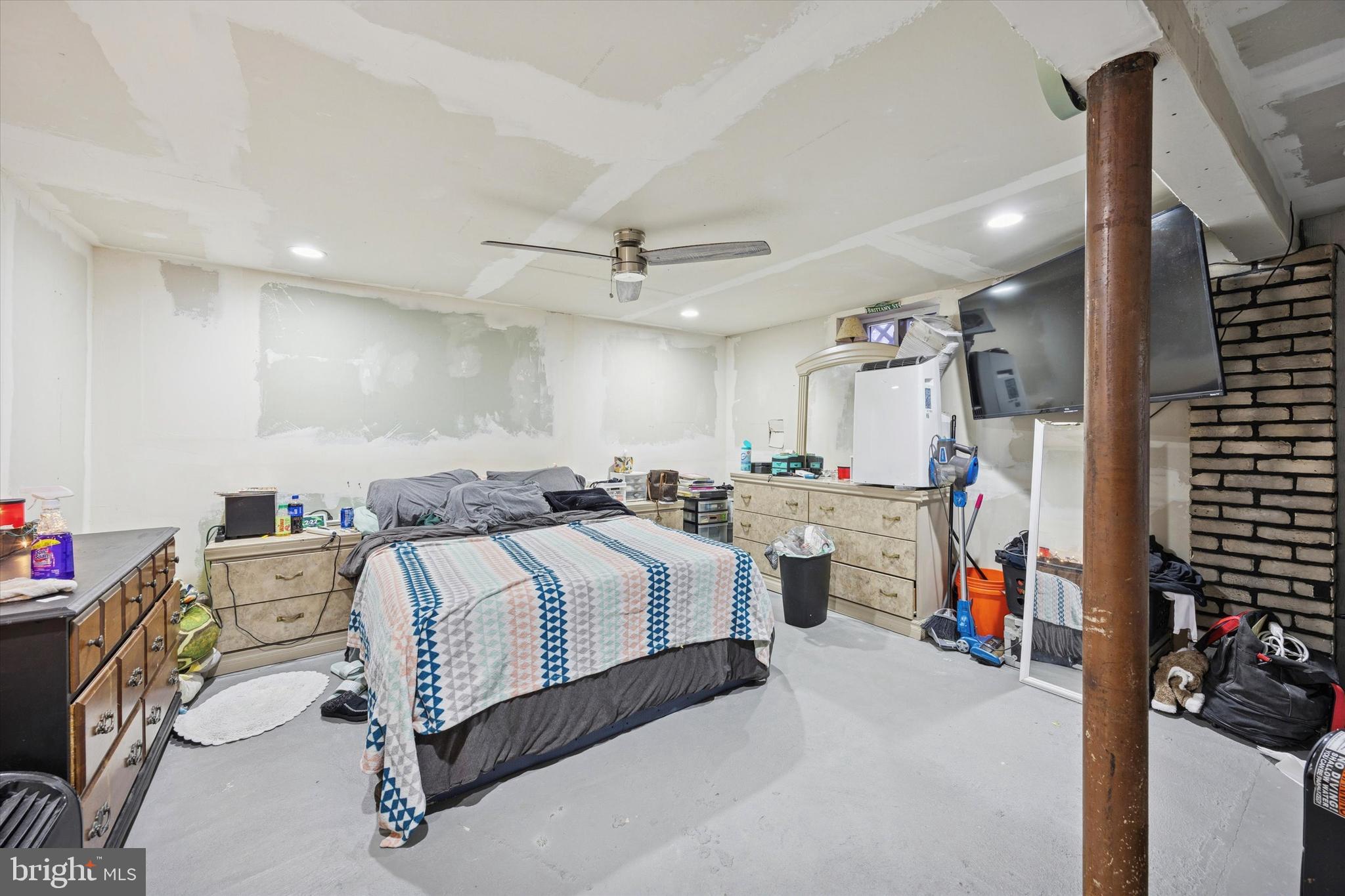 820 Keystone Street Croydon, PA 19021 - Photo 15 of 15 a spacious bedroom with a bed and a walk in closet