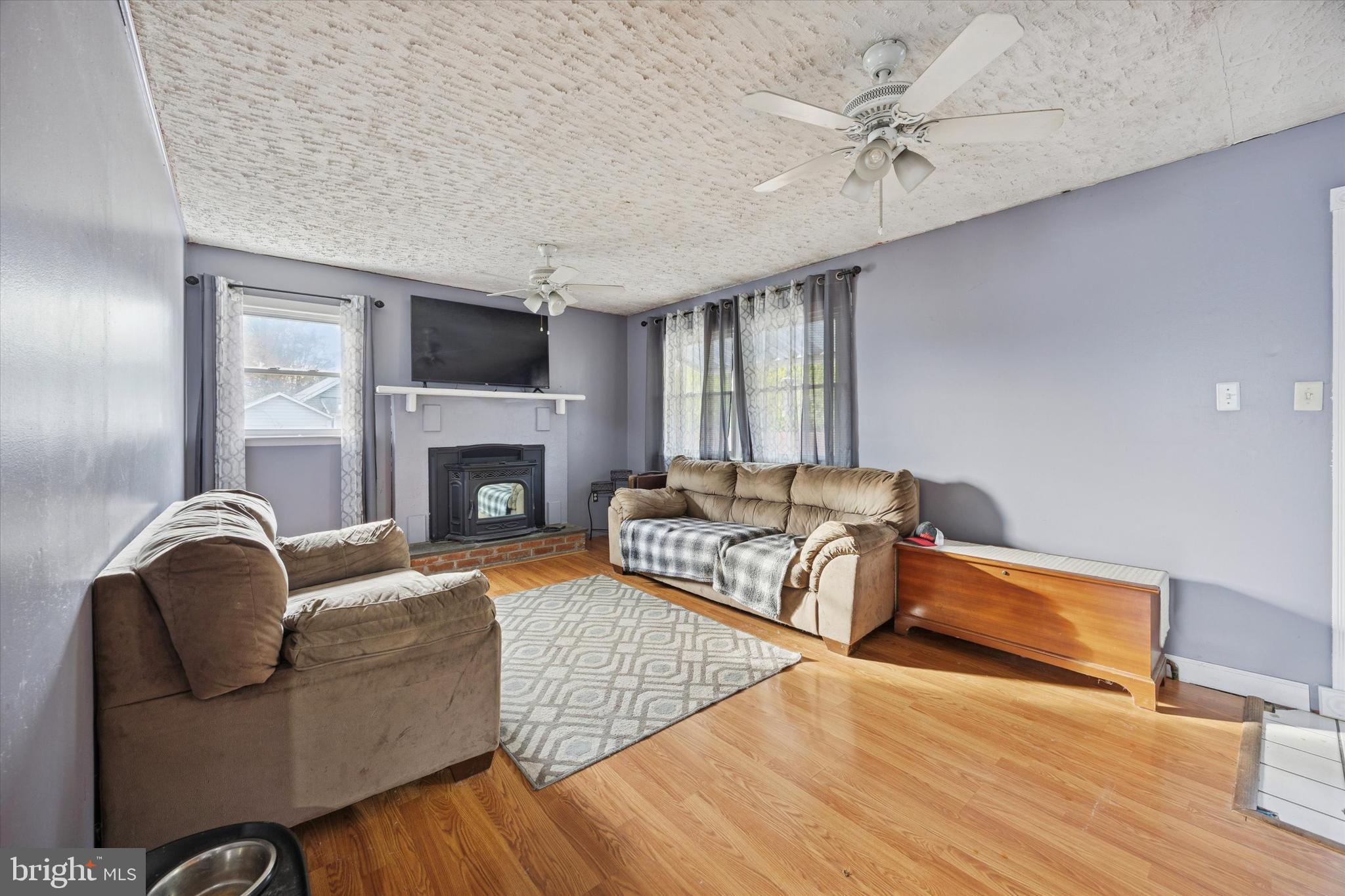 820 Keystone Street Croydon, PA 19021 - Photo 4 of 15 a living room with furniture and a fireplace