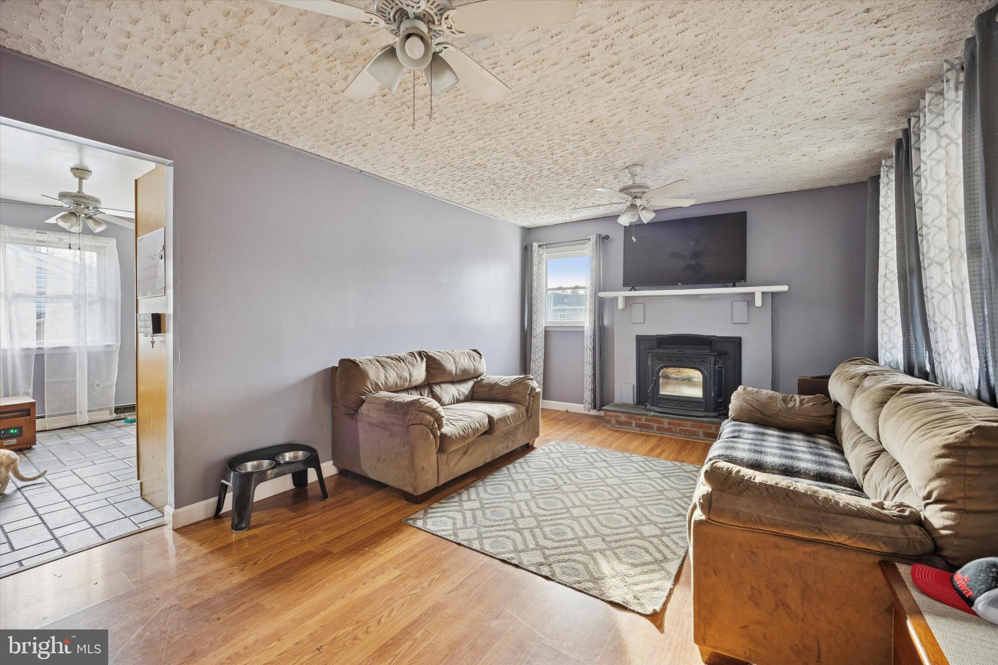 820 Keystone Street Croydon, PA 19021 - Photo 5 of 15 a living room with furniture and a fireplace
