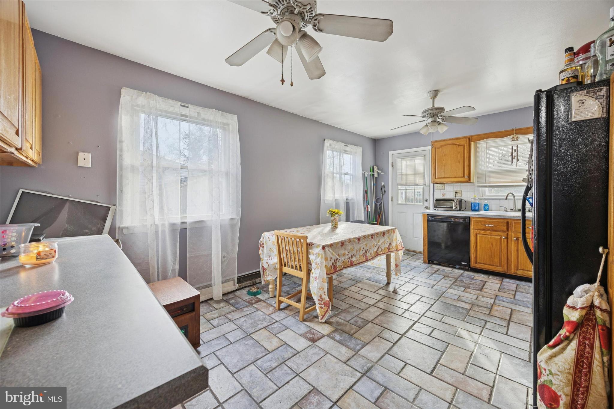 820 Keystone Street Croydon, PA 19021 - Photo 7 of 15 a kitchen with stainless steel appliances kitchen island granite countertop a refrigerator and a sink