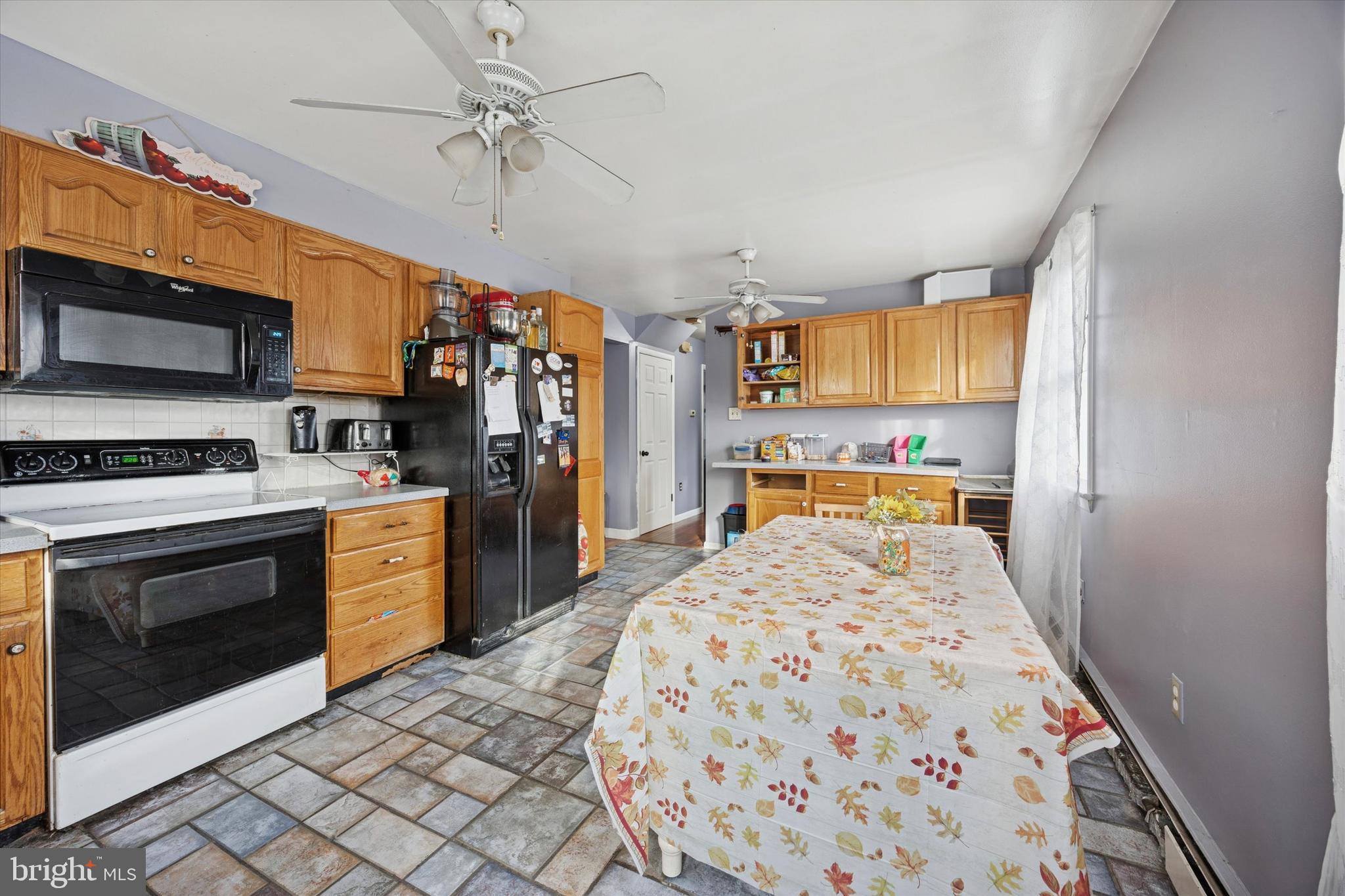 820 Keystone Street Croydon, PA 19021 - Photo 8 of 15 a large kitchen with a stove a sink dishwasher and a refrigerator with wooden floor