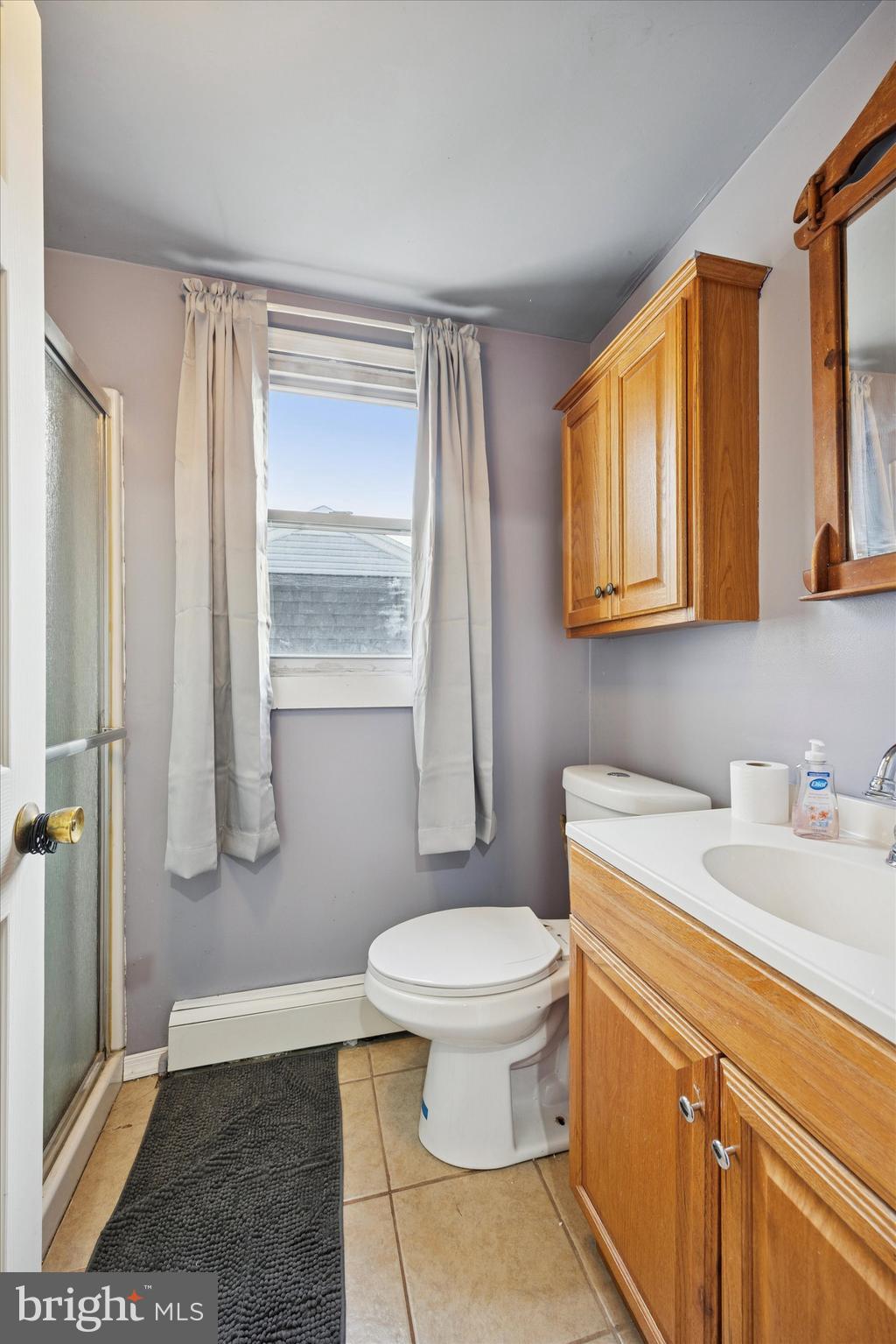 820 Keystone Street Croydon, PA 19021 - Photo 9 of 15 a bathroom with a sink a toilet and shower
