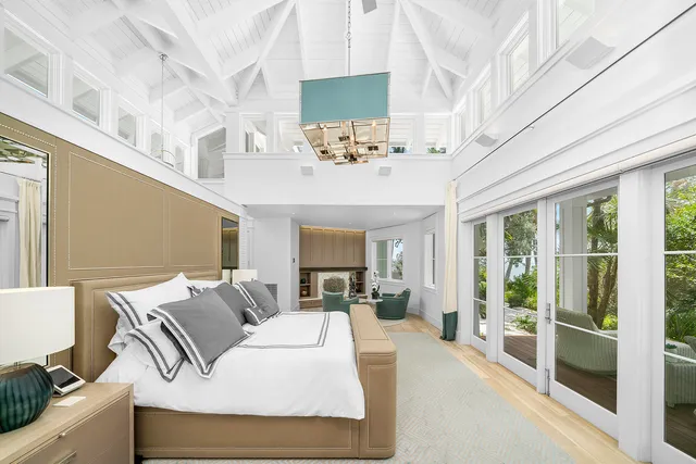 an aerial view of a house with a lake view