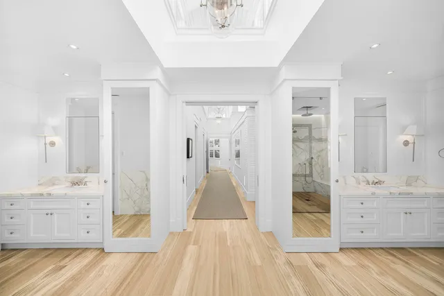 a view of a lake with boats and trees in the background