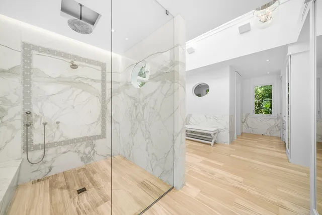 a view of a lake with houses in the back