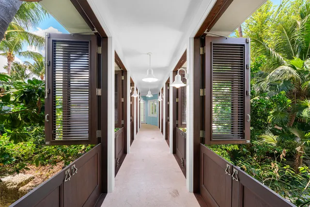 an aerial view of a houses with a yard