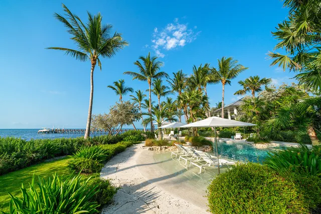 a view of a lake with a house in the background