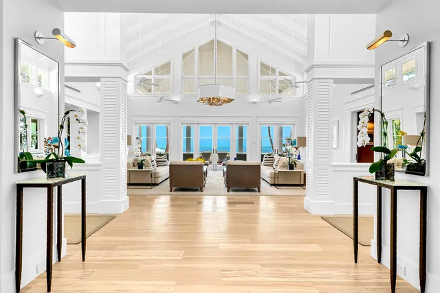 a kitchen with a stove a refrigerator and white cabinets