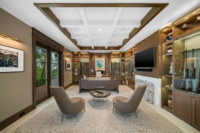 a living room with furniture a window and a rug