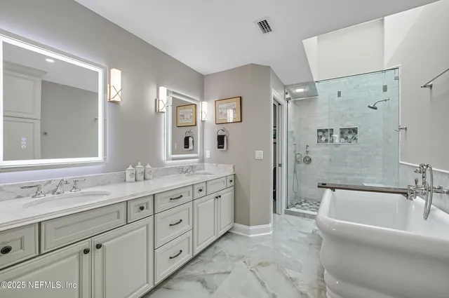 a bathroom with a tub and a shower